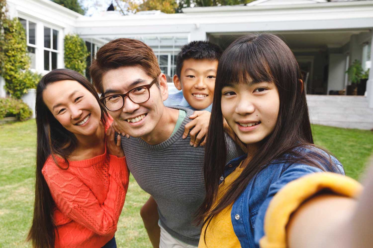 parenting-teens-portrait-of-happy-asian-parents-son-and-daughter-2023-11-27-04-52-15-utc